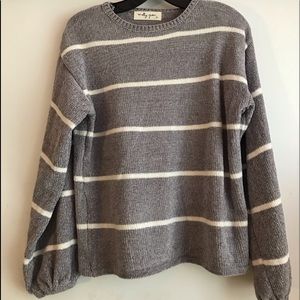 Molly green gray sweater with white stripes.